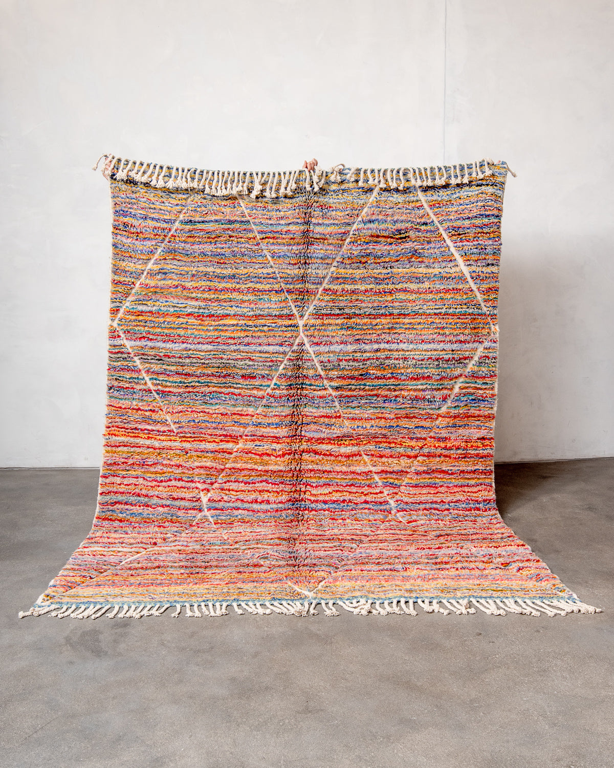 Modern, designer, handcrafted Berber rug from Morocco. Beniourain carpet with beautiful colours and patterns and fluffy wool texture.